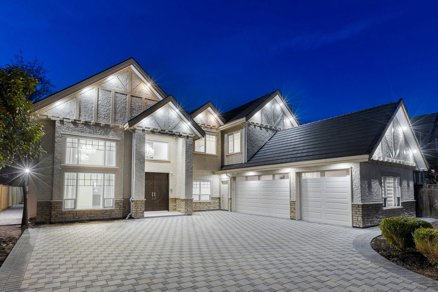 Exterior of a custom-built luxury home at dusk