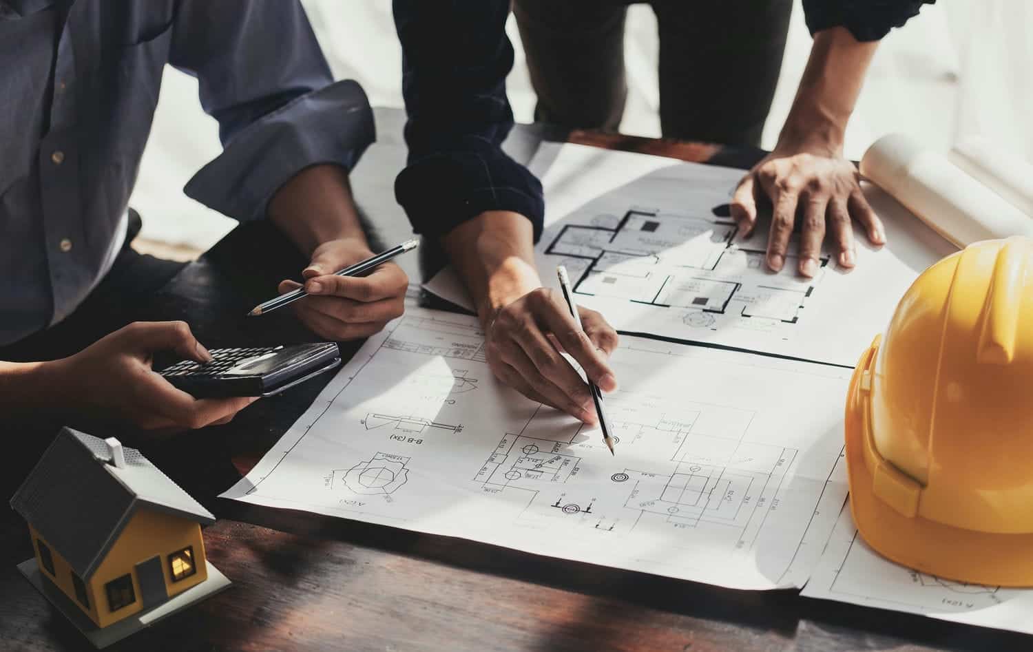 home builder and architect discussing plans