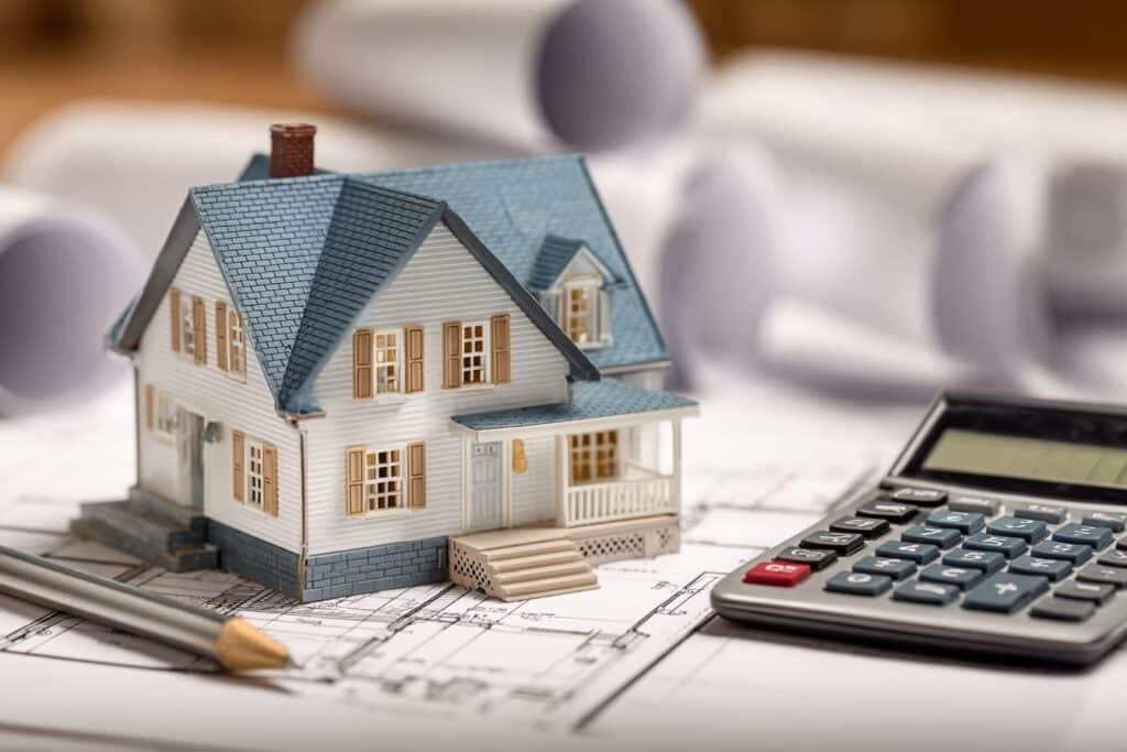 Custom home construction in the Lower Mainland BC with budget planning documents showing cost considerations