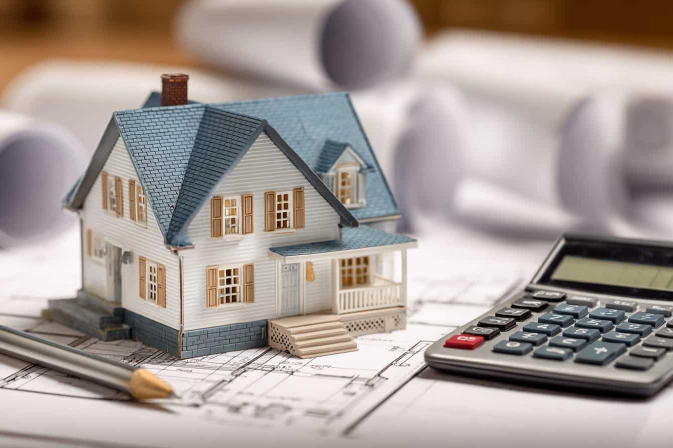 Custom home construction in the Lower Mainland BC with budget planning documents showing cost considerations